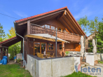Gartenansicht - Natürlich. Individuell. Besonders. – Charmantes Blockhaus mit großzügigem Wohnambiente und Garten