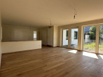 Wohnzimmer mit Blick in die offene Küche - Sie suchen ein neu errichtetes & schickes Wohnhaus mit Garten zur Miete? (Gartenaufbau im August 24)